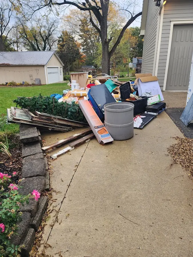 Dumpster being loaded with debris for 10 Yard Dumpster Rental in Apple Valley